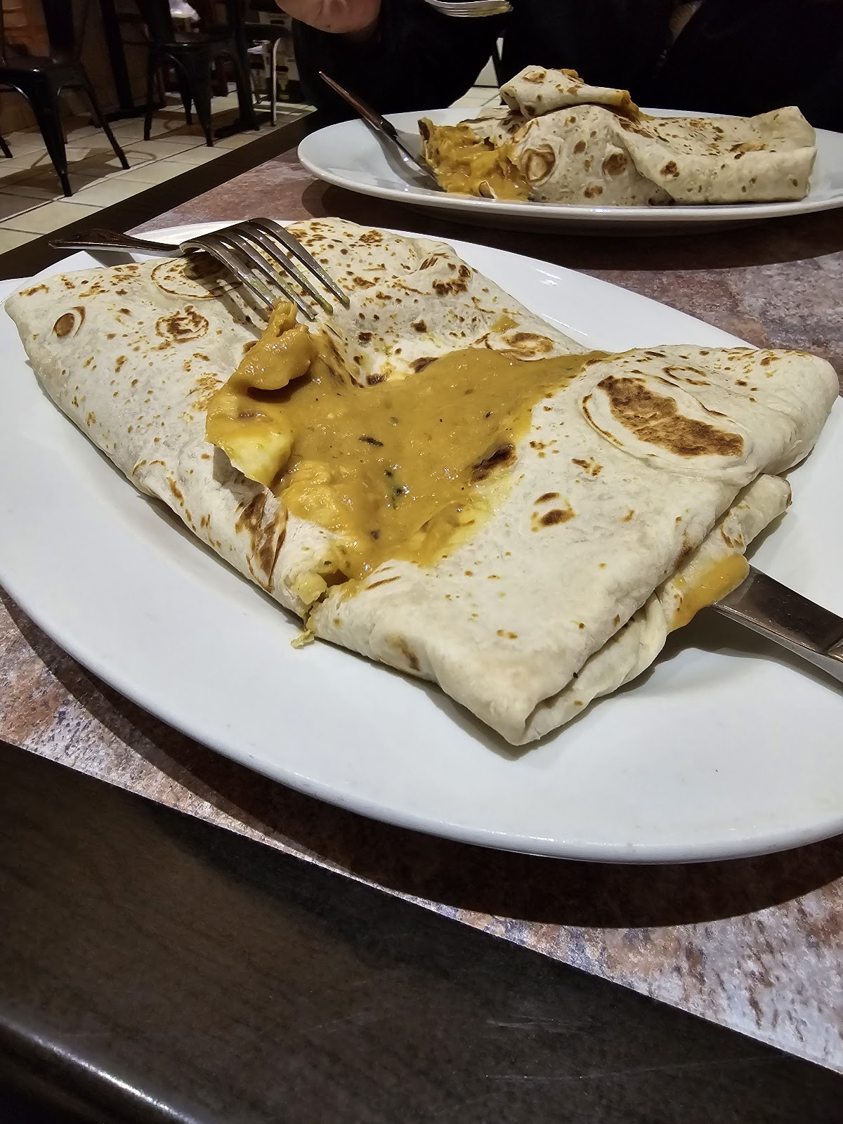 Indian dish plated at Mother India Roti Queen St West